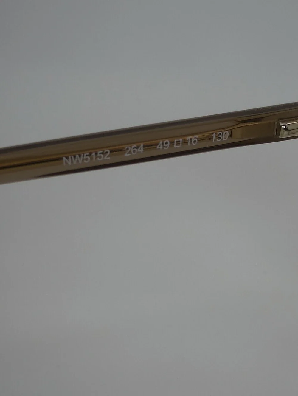 Nine West NW5152 Taupe Cat-Eye Eyeglass Frames with Pearl Accent.